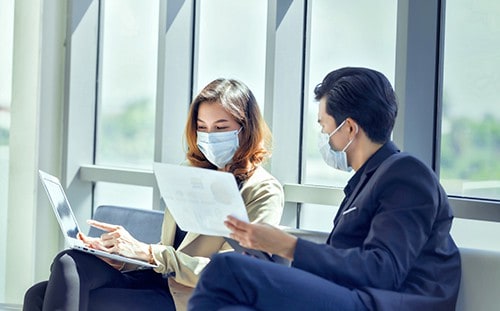 business-workers-discussing-wearing-medical-face-mask