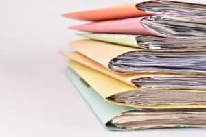 colorful paperwork Stacked files on isolated background