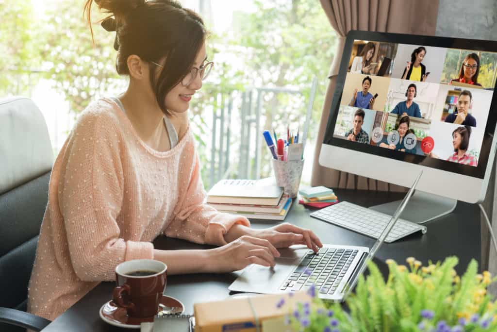 Asian woman work from home during corona virus, COVID-19 out break use laptop for teleconference with her teamates